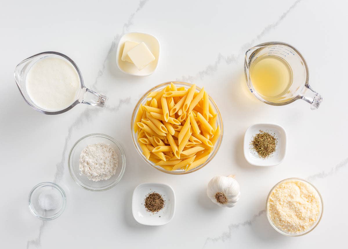 Penne pasta ingredients on the counter.