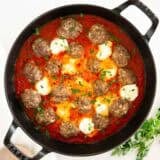 Ricotta meatballs in a skillet.
