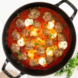 Ricotta meatballs in a skillet.