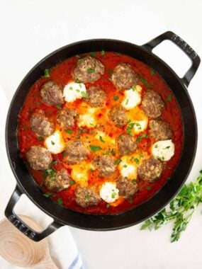 Ricotta meatballs in a skillet.