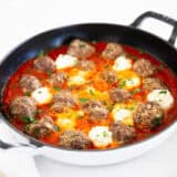 Ricotta meatballs in a skillet.