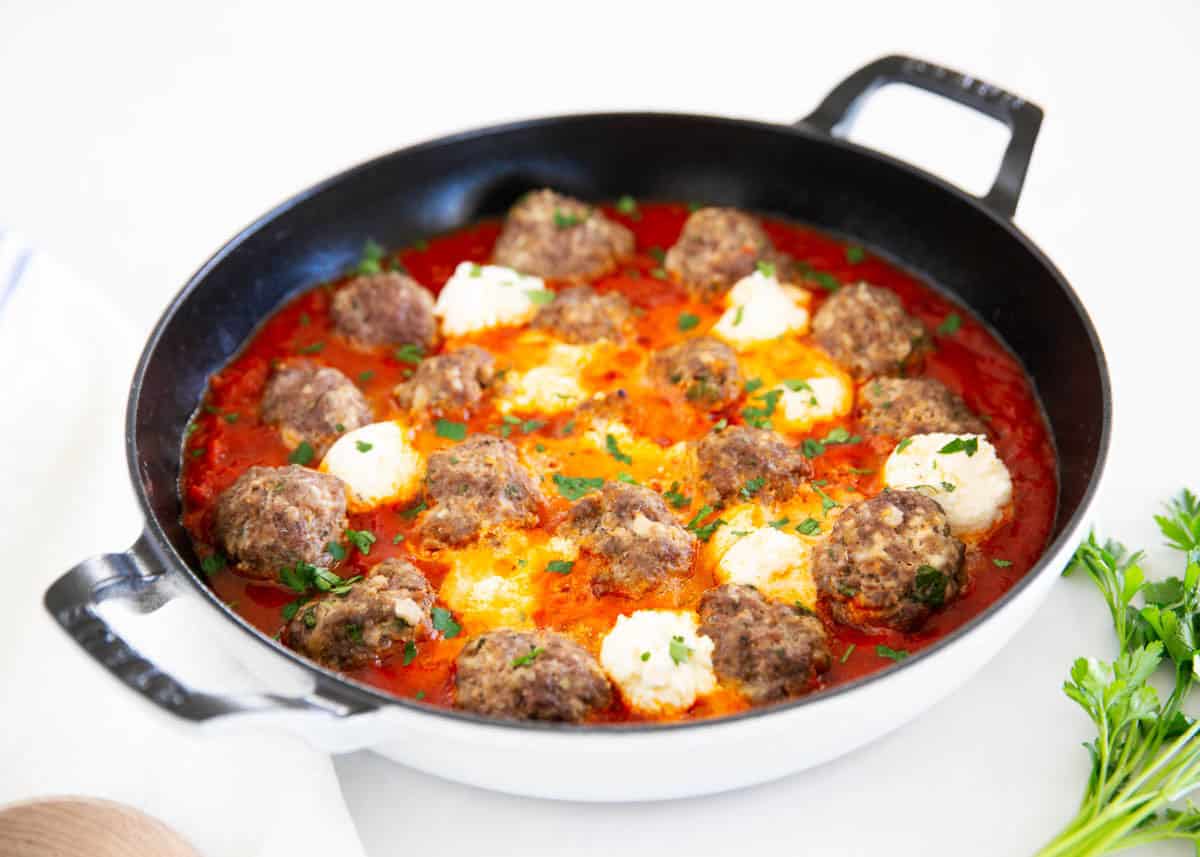 Ricotta meatballs in a skillet.