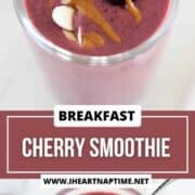 Cherry smoothie in a glass with a cherry, sliced almonds and almond butter drizzle.