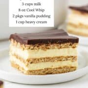 Chocolate eclair cake on a plate with ingredients.