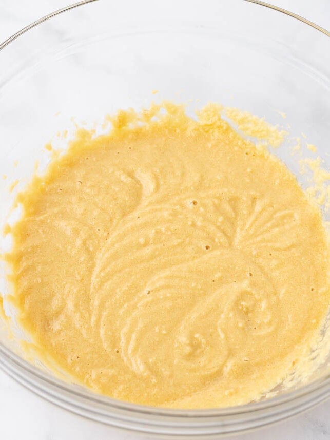 Creaming cookie dough in a bowl.