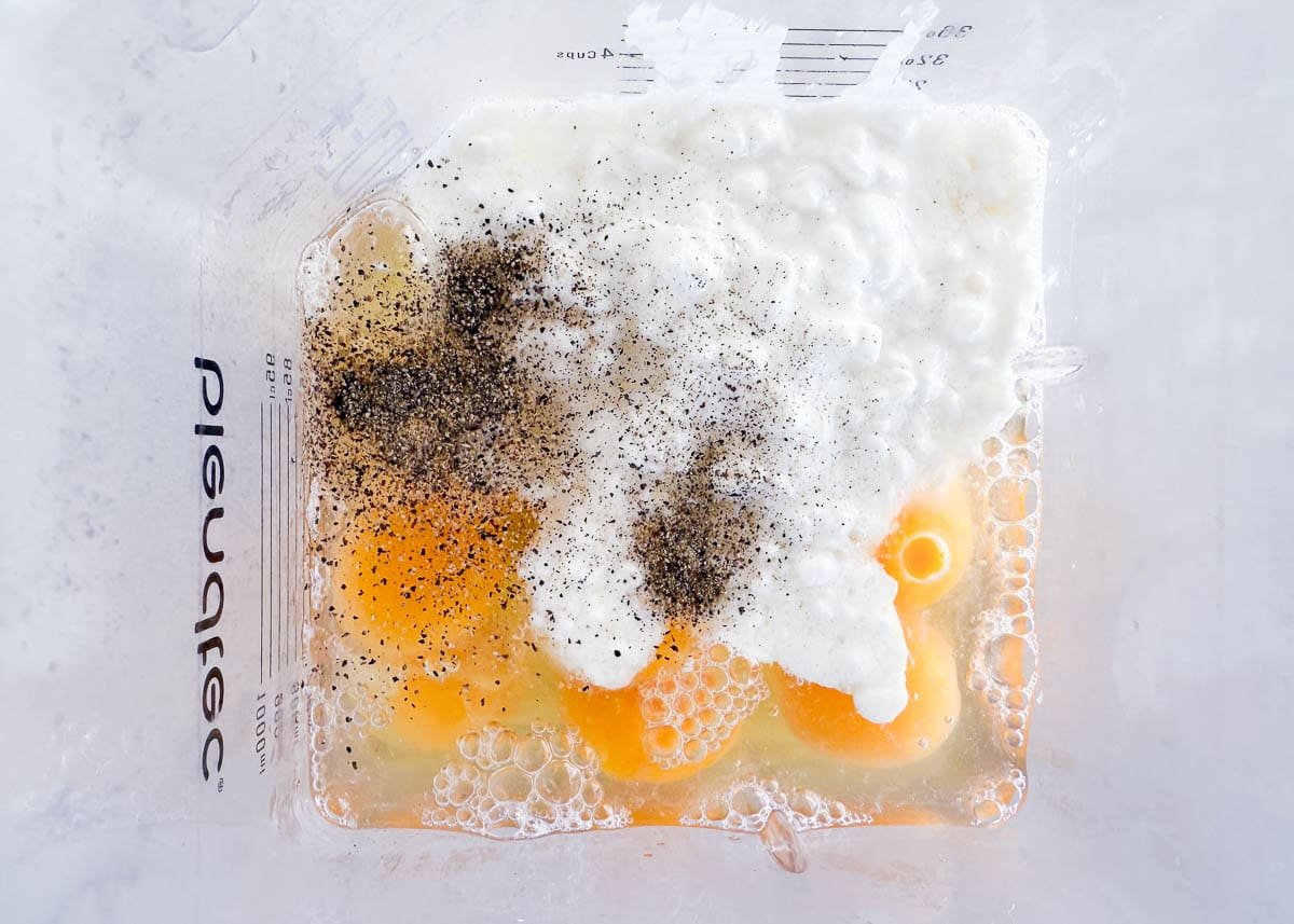 Eggs, cottage cheese, salt, and pepper blended together to make the base for cottage cheese egg bites.