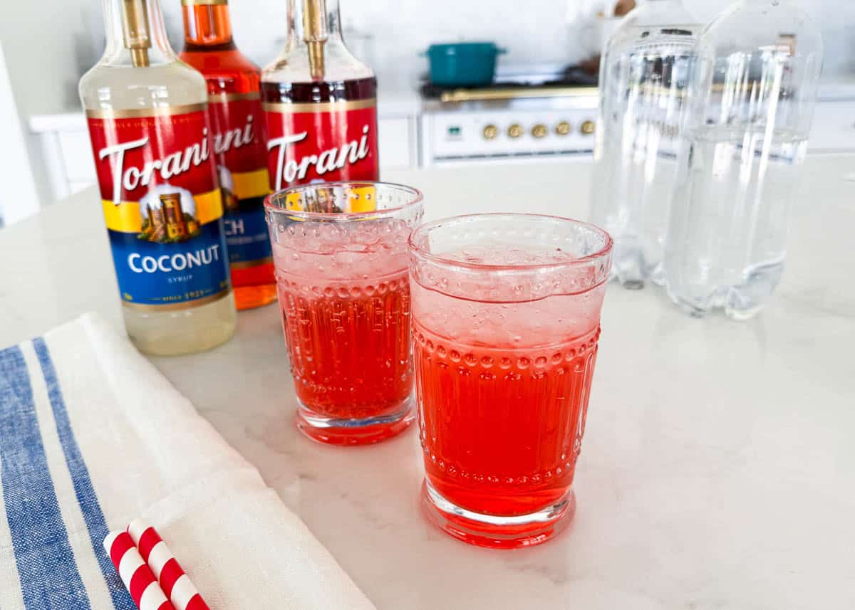 Showing how to make italian soda.