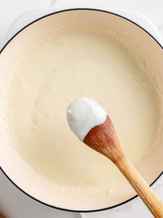 Making creamy pasta sauce.