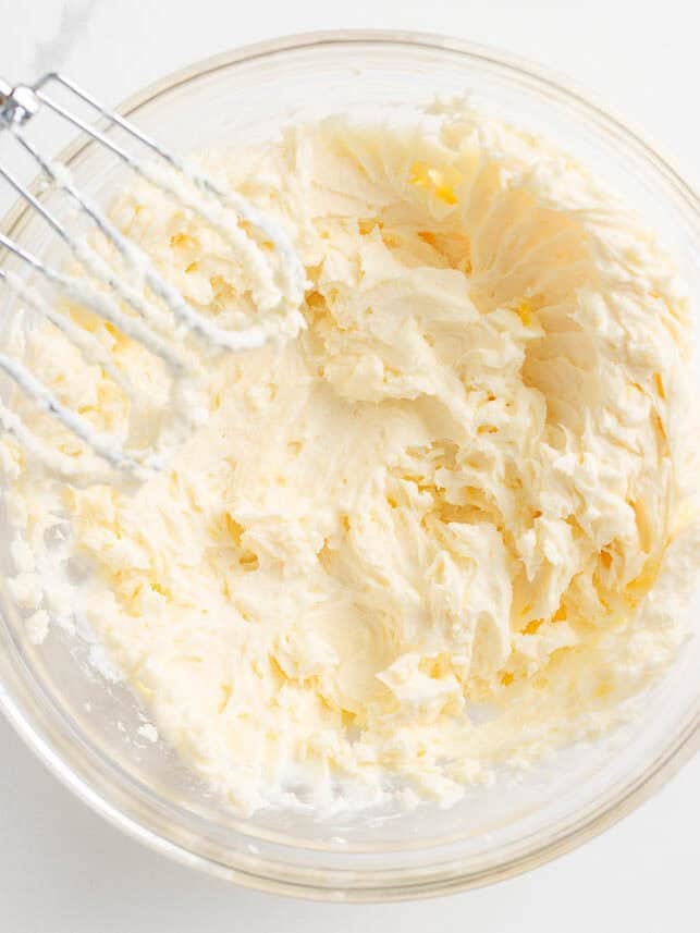 Whipping mascarpone and cream in a bowl.