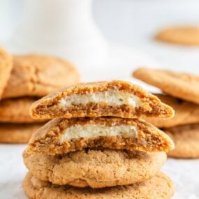A stack of four cheesecake cookies on the ocunter.