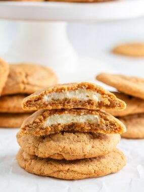 A stack of four cheesecake cookies on the ocunter.