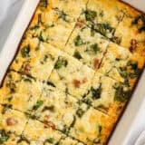 Sliced breakfast casserole in baking dish.