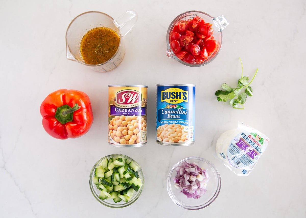 Learn to make this simple, dense bean salad TikTok sensation! It's fresh and healthy, vibrant and colorful, with plenty of crunch, then tossed in a tangy homemade dressing. Dense bean salad ingredients.