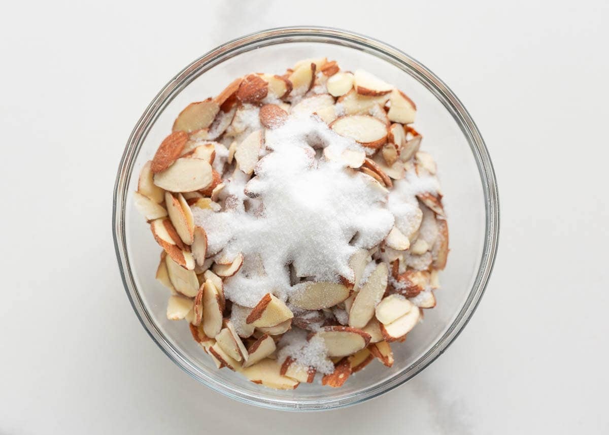 Bowl of sliced almonds mixed with sugar for the almond torte topping.