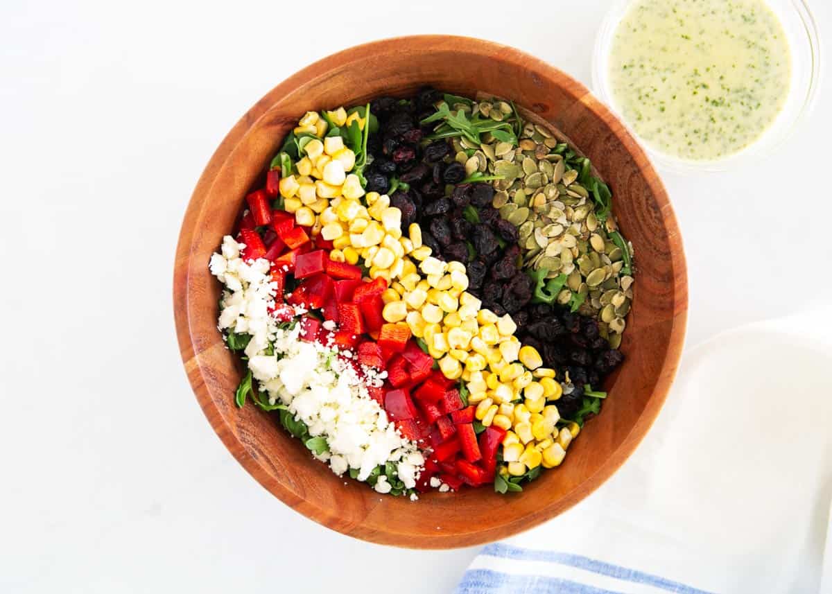 Chopped arugula salad ingredients in a bowl.