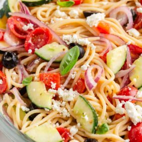 Close up photo of spaghetti salad in a bowl.