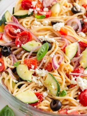 Close up photo of spaghetti salad in a bowl.