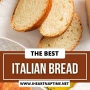 Italian bread sliced with dipping oil on parchment lined counter.