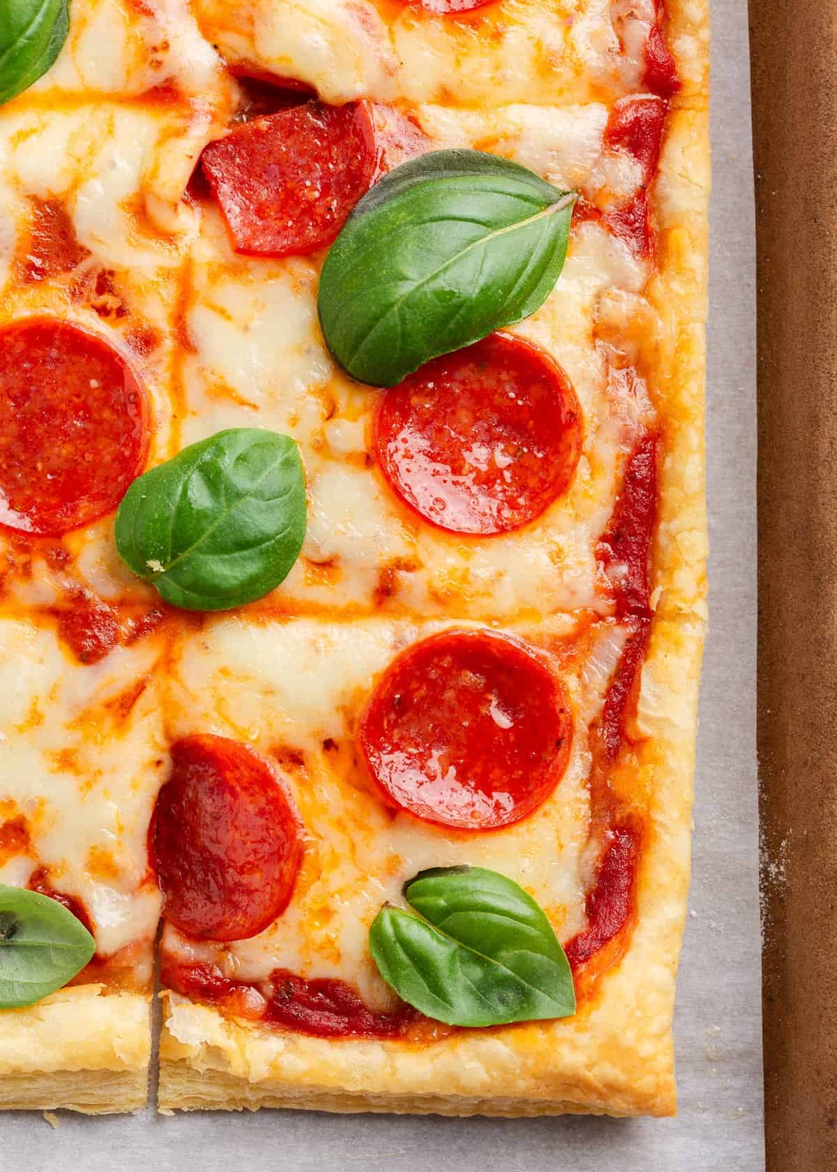Close up of pizza made with puff pastry.