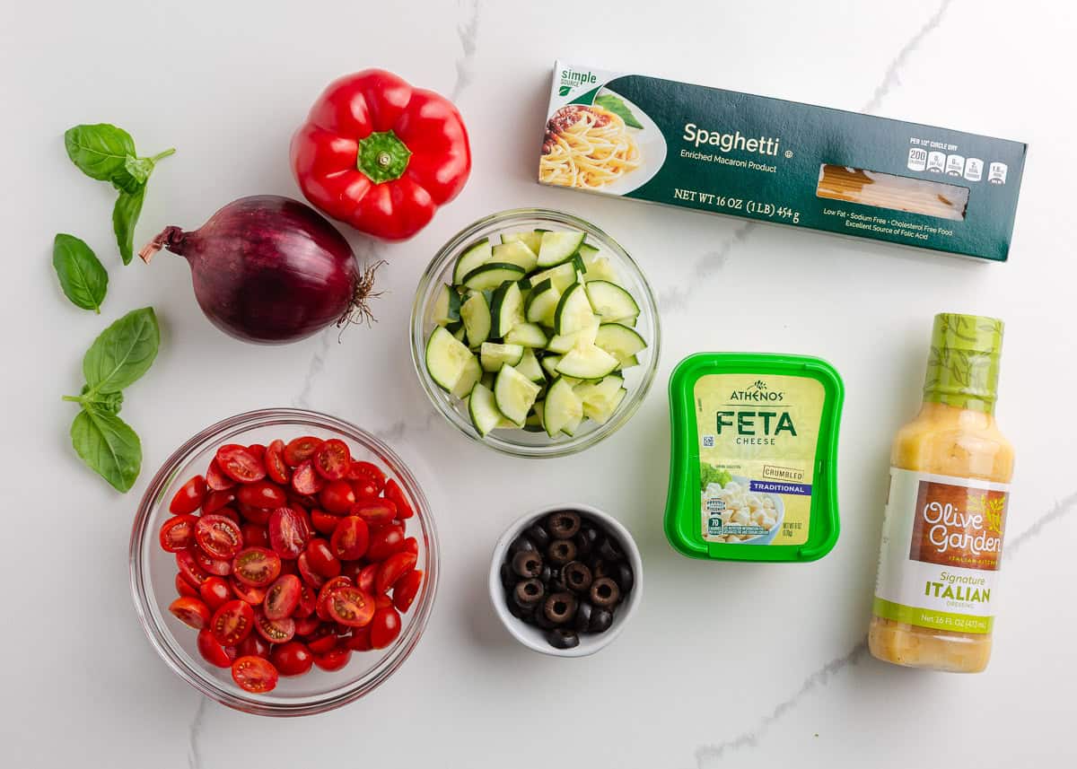 Spaghetti salad ingredients on the counter.