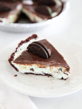 A slice of grasshopper pie made with mint ice cream on a plate.