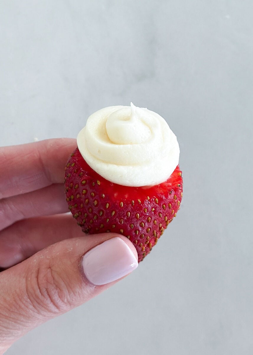 Cream cheese stuffed strawberry with piped cheesecake filling.