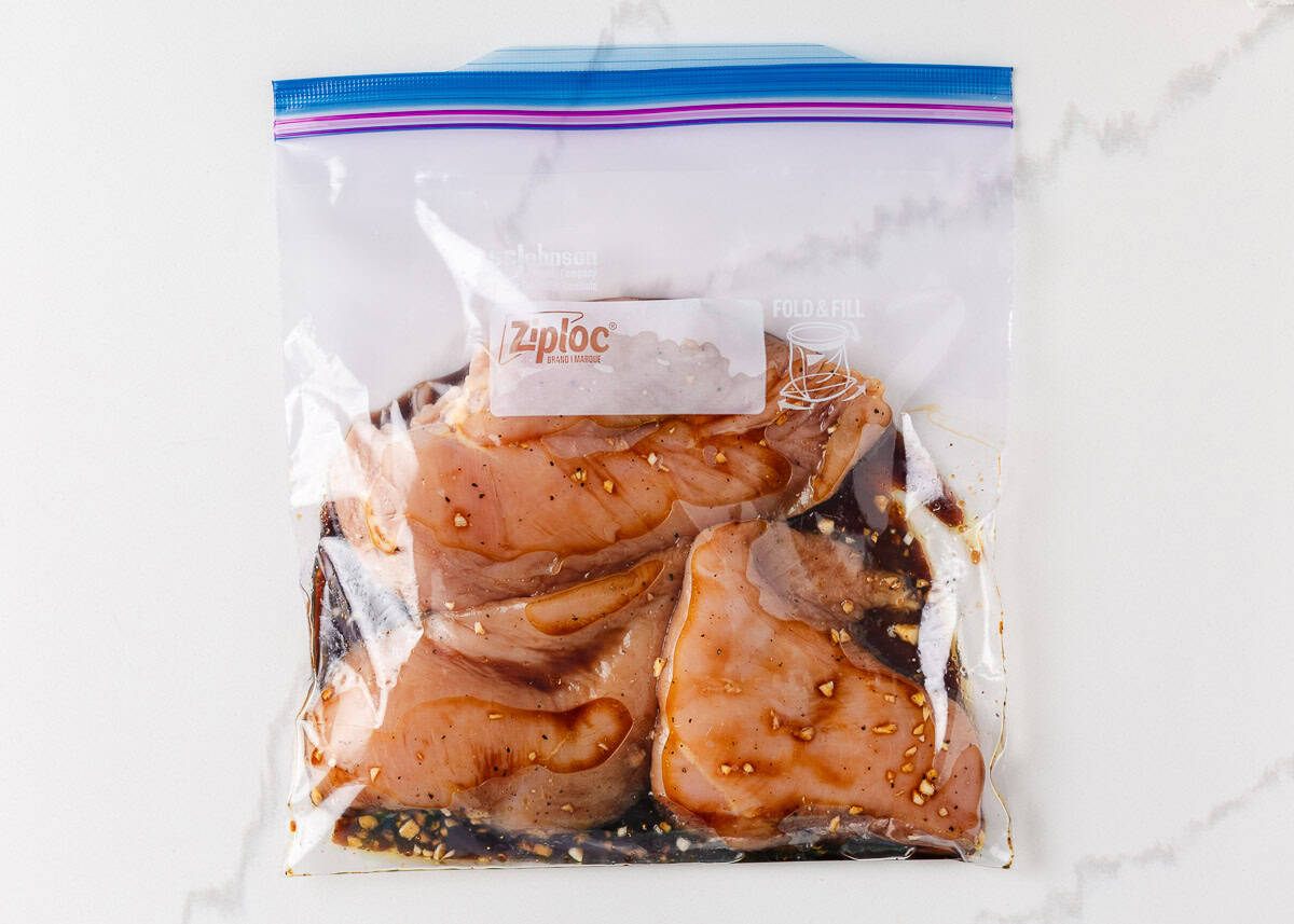 Marinating chicken breast in a zip top bag.