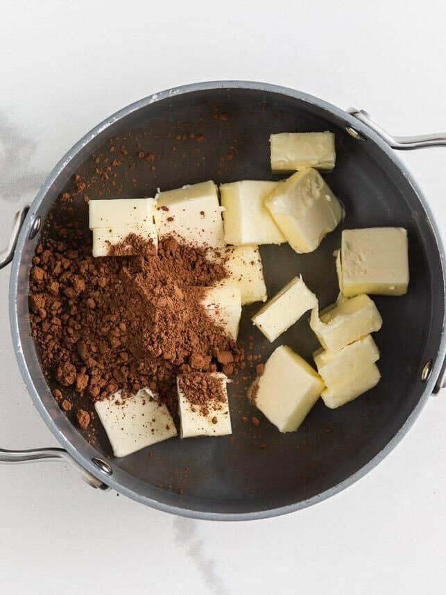 Butter and cocoa powder in a pot.