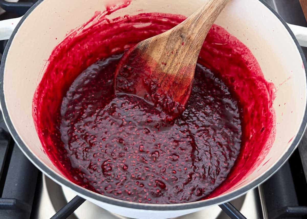 Showing how to make raspberry jam.