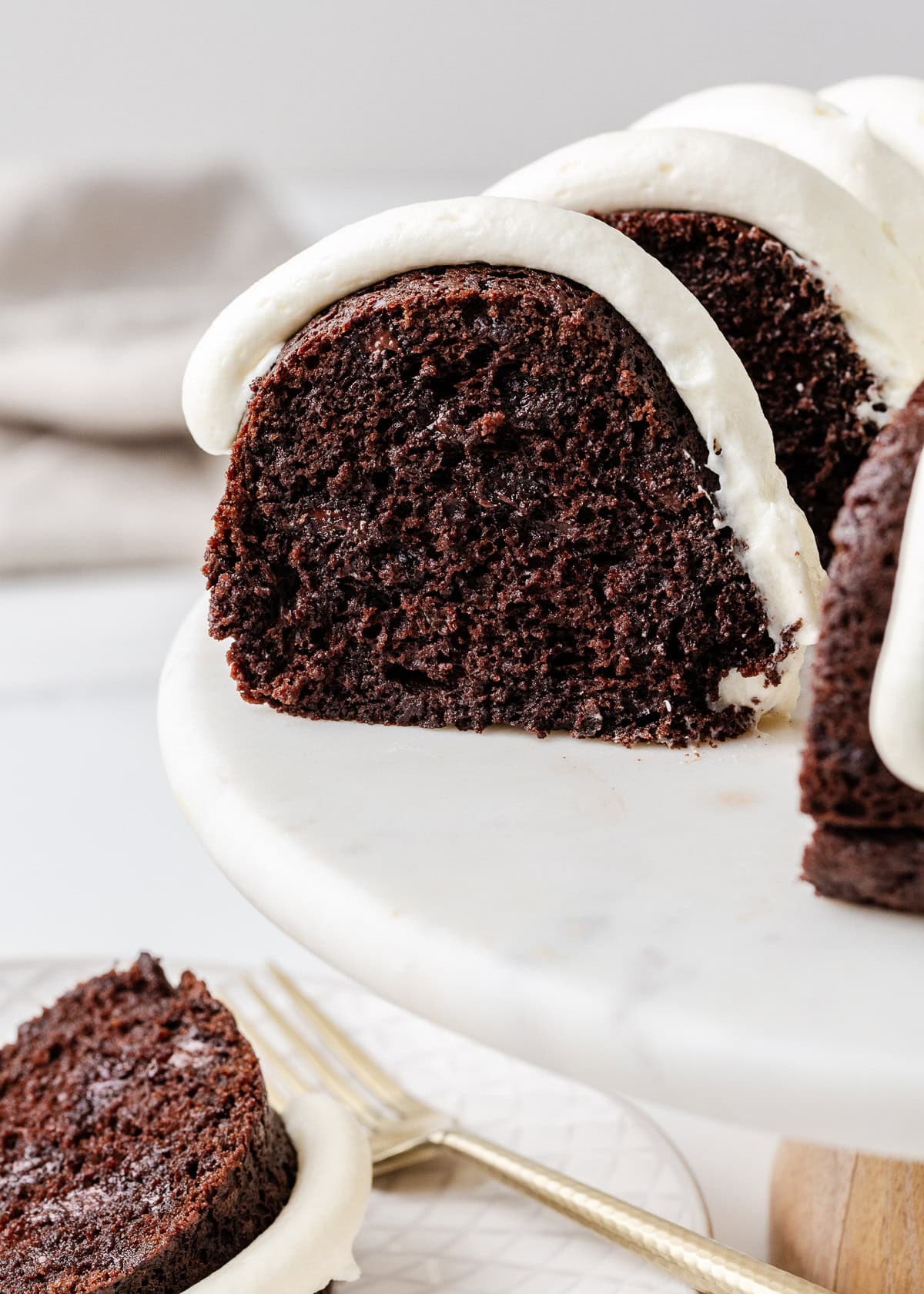 Nothing bundt cake sliced on a cake stand.