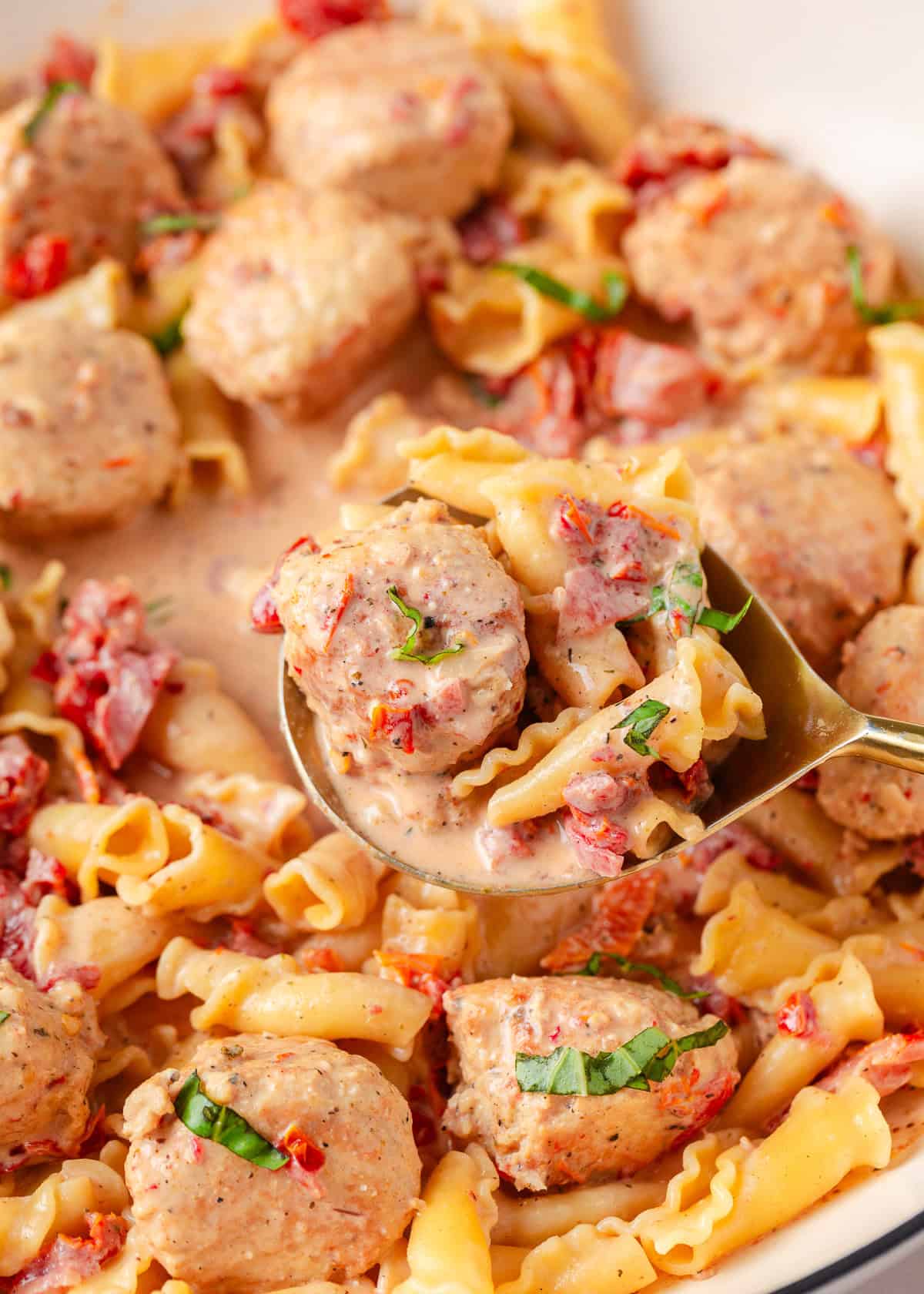 Marry me chicken meatballs being served with pasta.