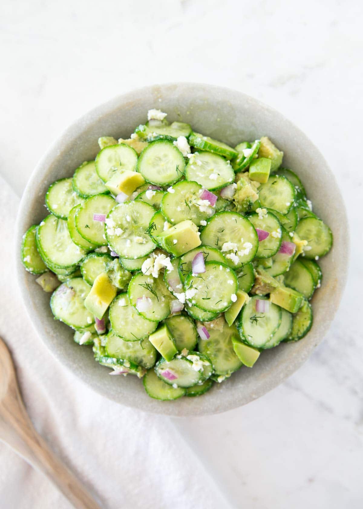 Cucumber avocado salad in a bowl.
