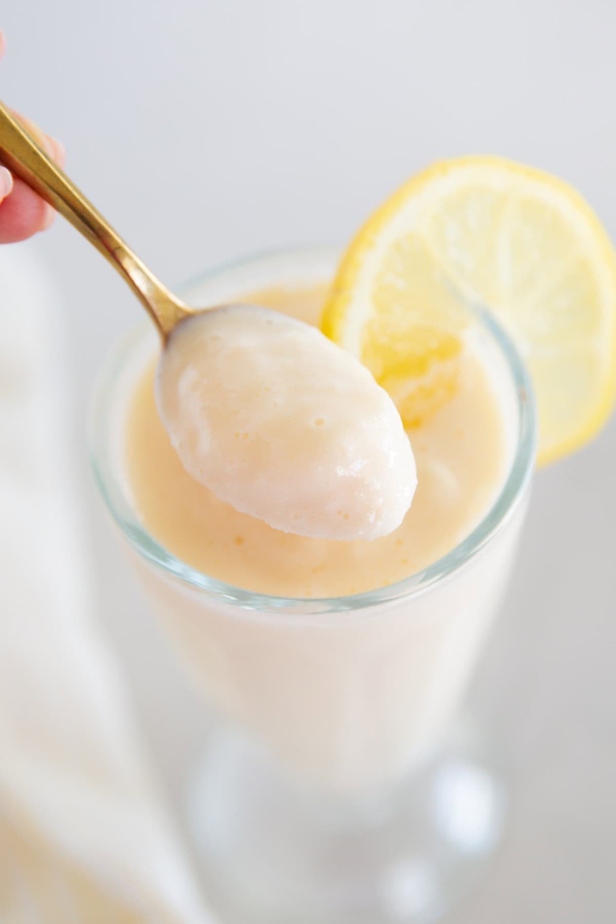 Spoonful of chick fil a frosted lemonade.