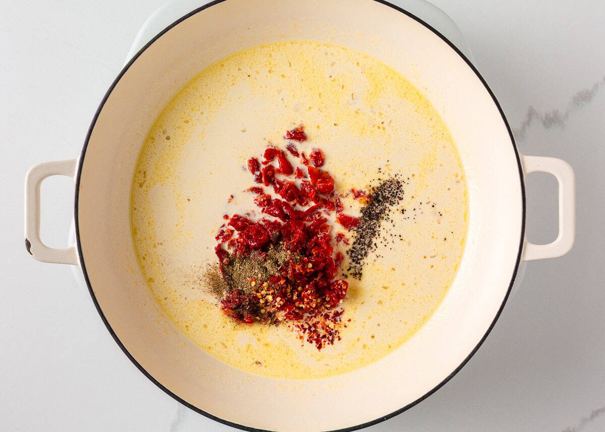 Sun dried tomato cream sauce in a pot.