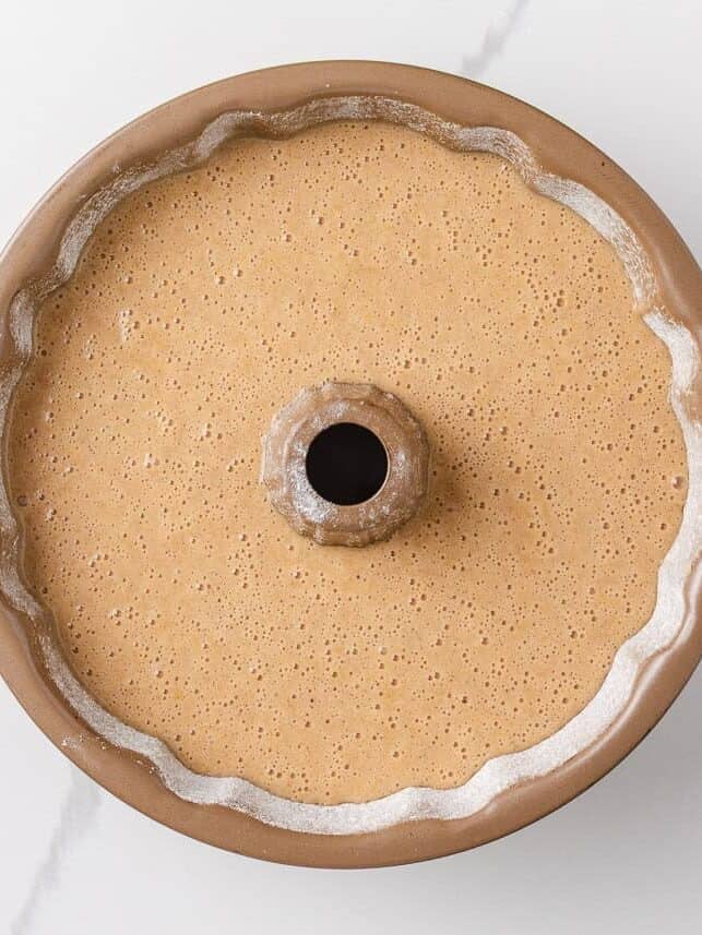 Batter for apple cider donut cake in a bundt pan.