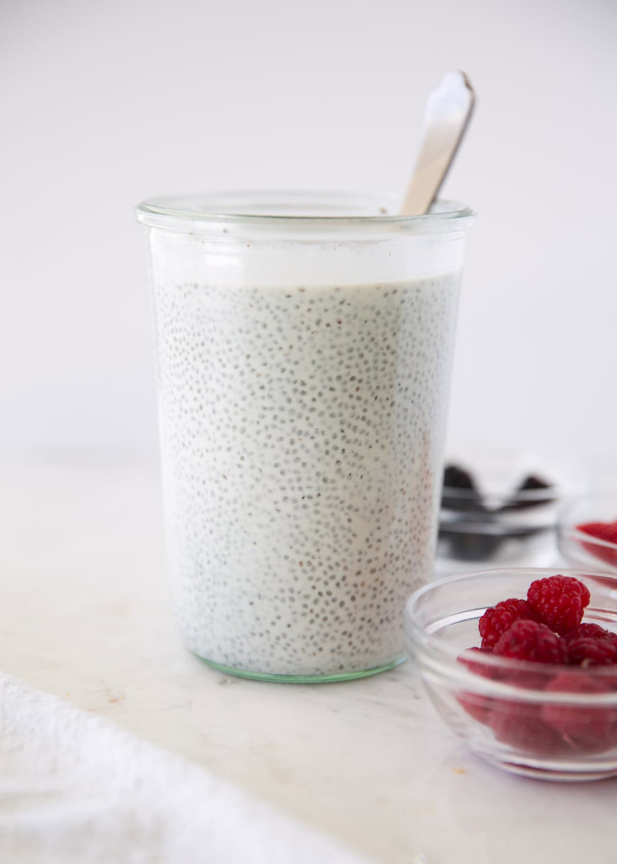 Get a jump on tomorrow's breakfast or quick and healthy snack with this creamy chia seed pudding recipe. It's simple to make, completely customizable and perfect for meal prep! Chia seed pudding in a glass jar.