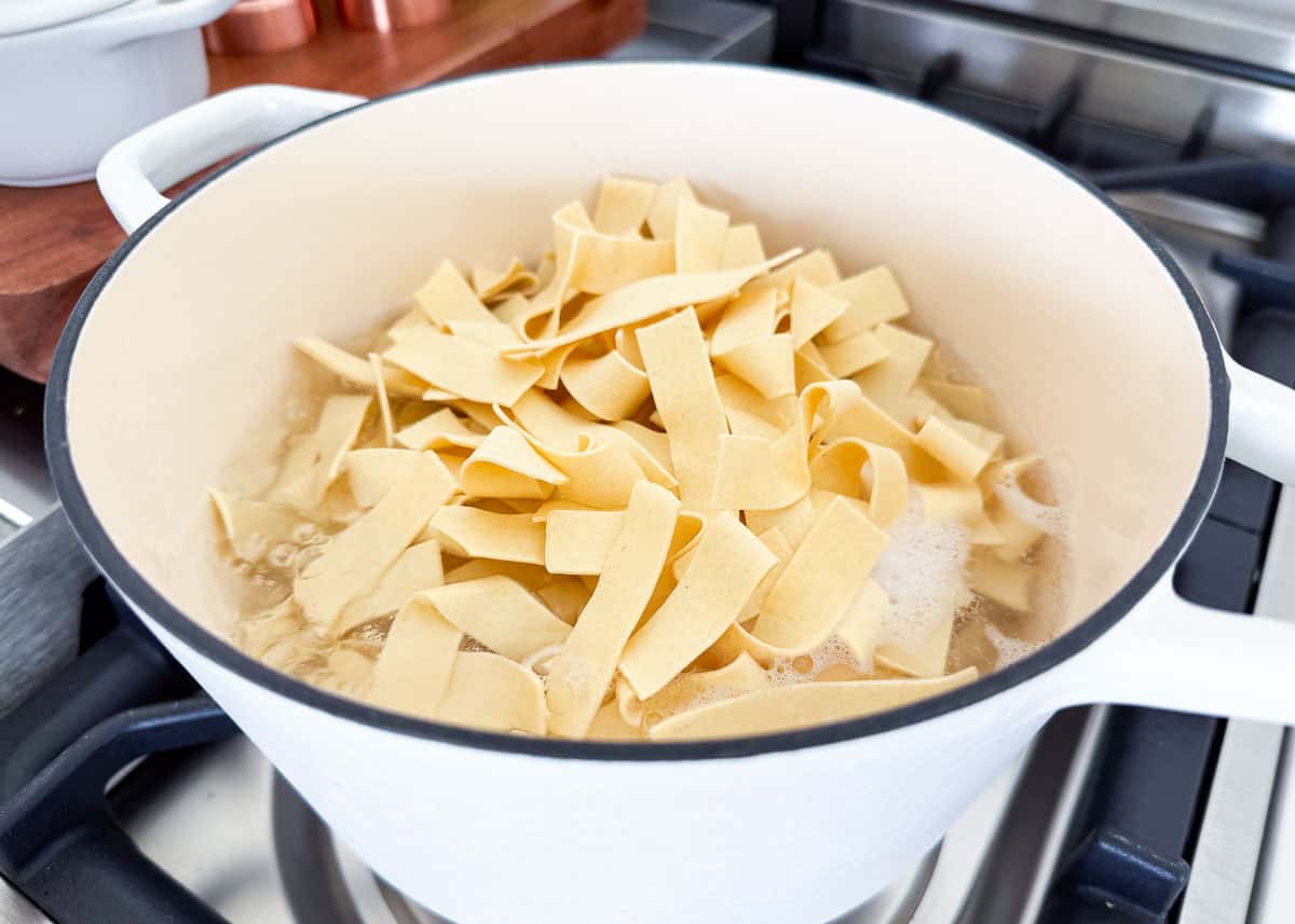 Boiling noodles in a pot.