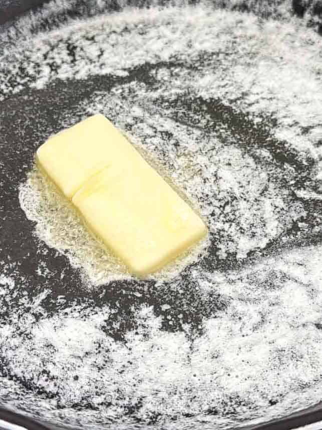Cooking butter in a skillet.