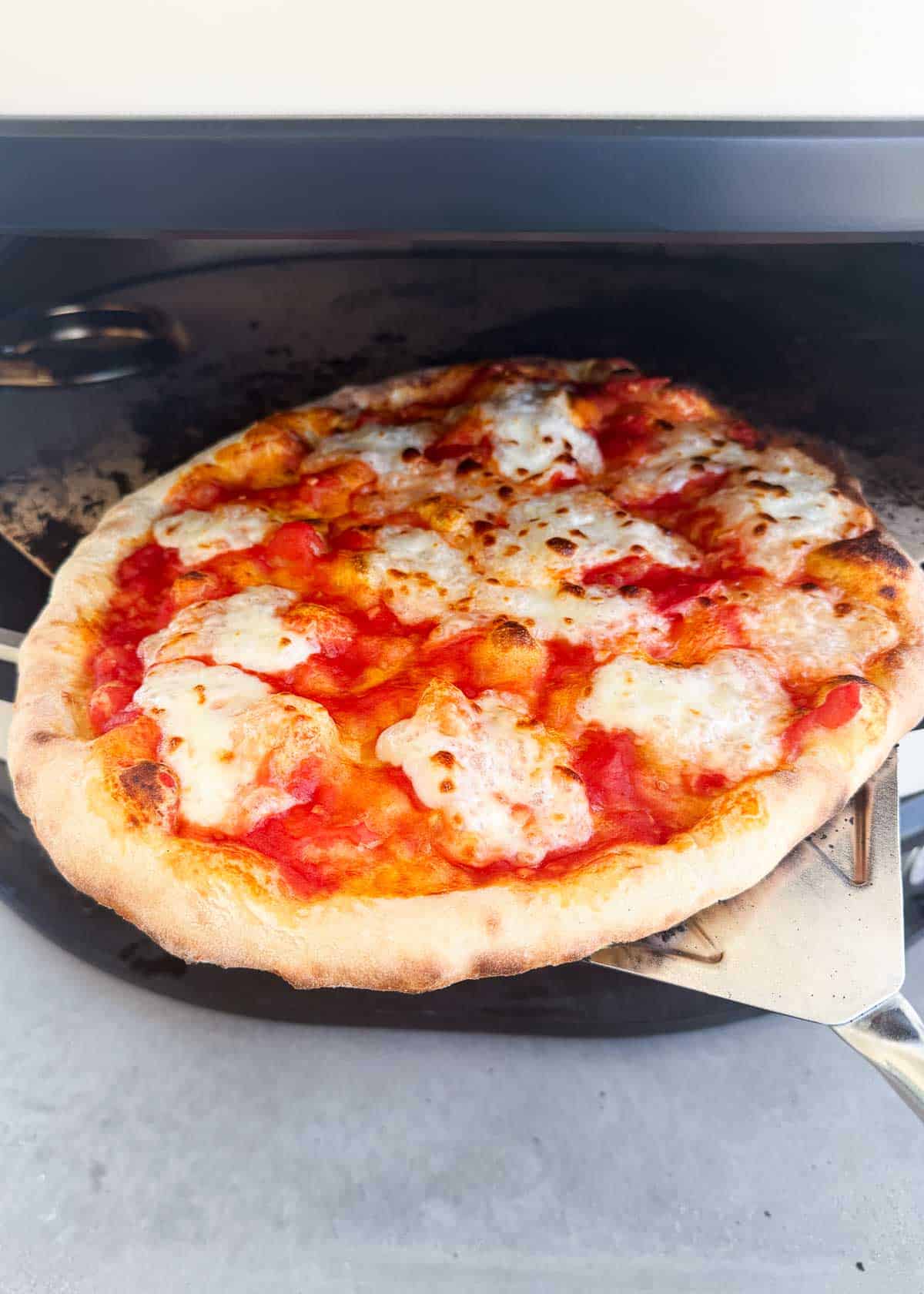 Margherita pizza in a pizza oven.