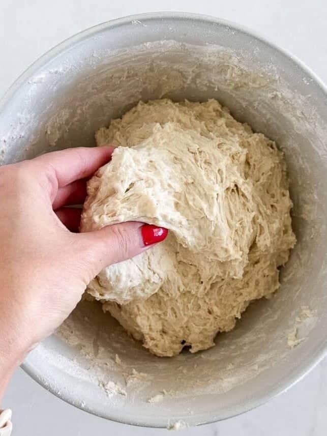 Mixing dough in a bowl.