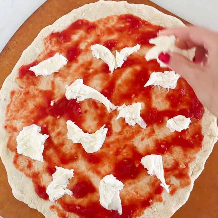 Showing how to make Margherita pizza.