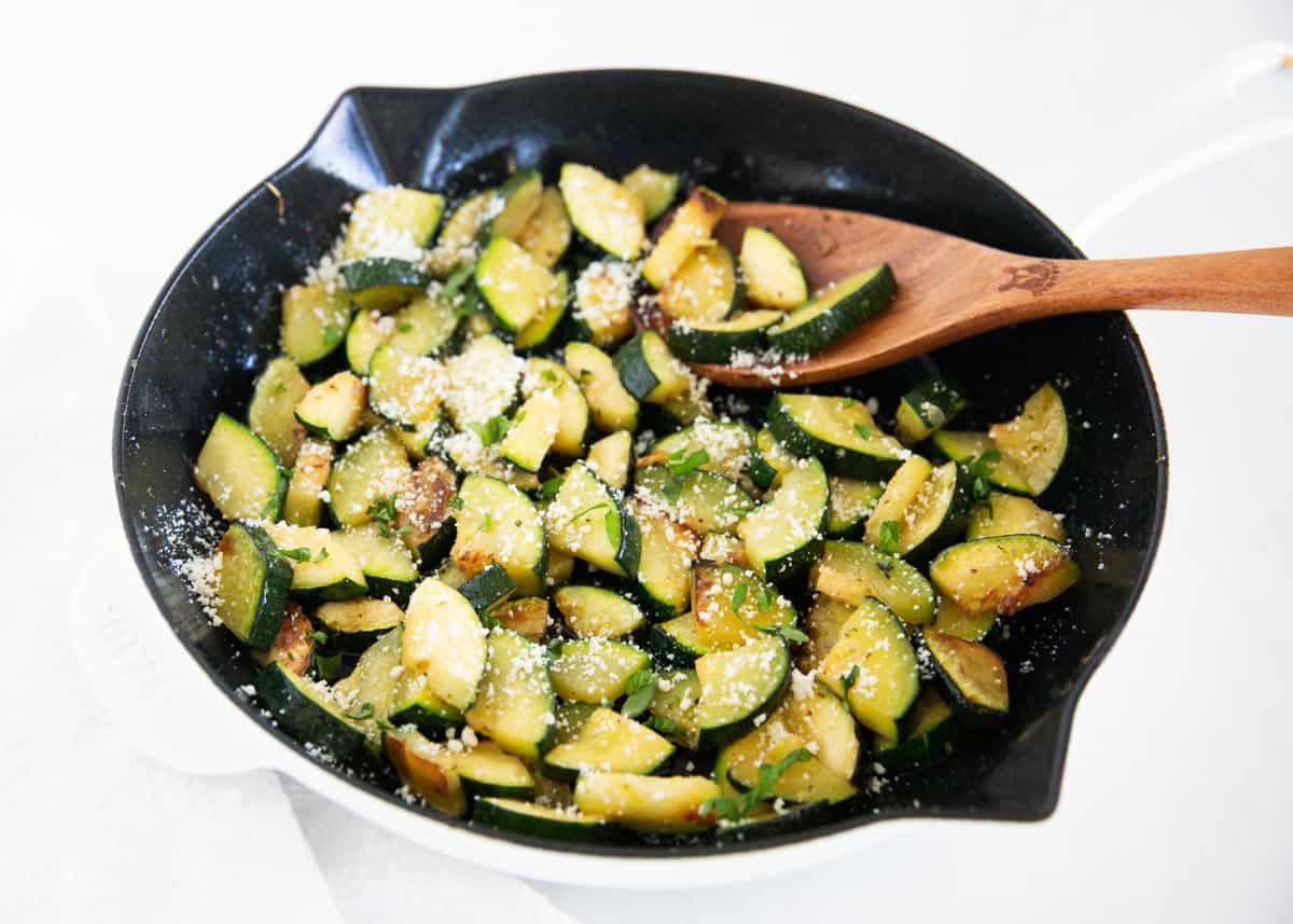 Saut&eacute;ed zucchini cooked in a skillet until tender and lightly golden, then finished with olive oil, Italian seasoning, and parmesan cheese.