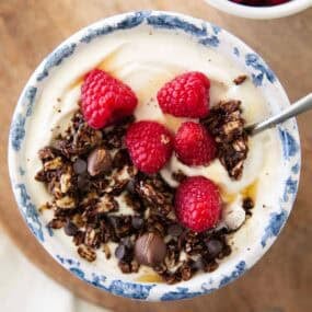 Chocolate granola and yogurt in a bowl.