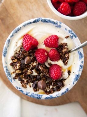 Chocolate granola and yogurt in a bowl.