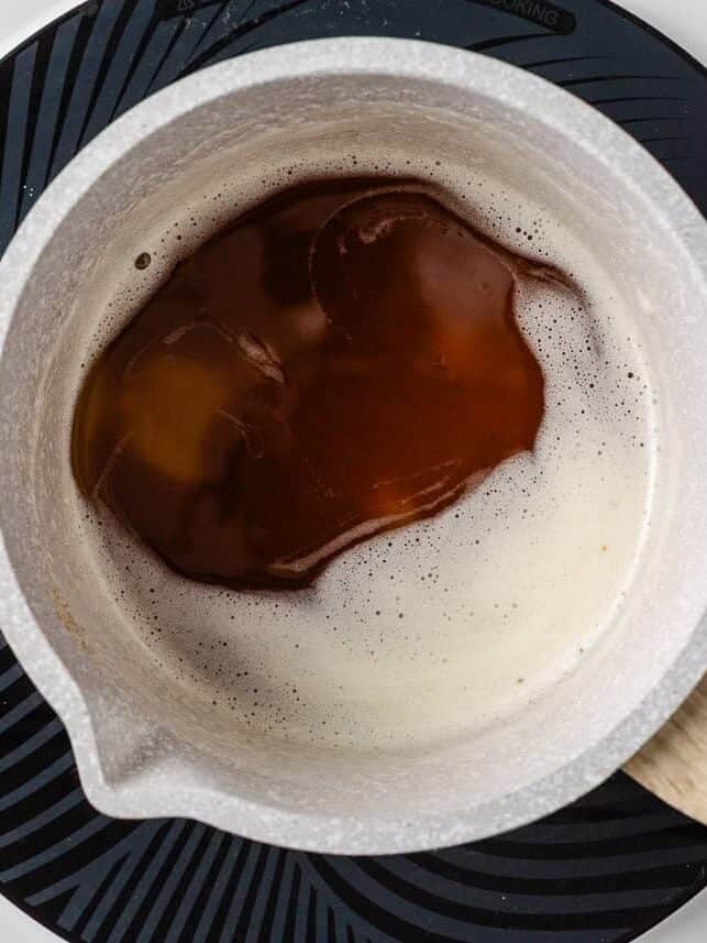 Perfectly spiced and deliciously sweet with the nutty aroma of brown butter, these chewy brown butter pumpkin cookies deliver all the fall coziness in every bite! Freshly browned butter in a small saucepan.