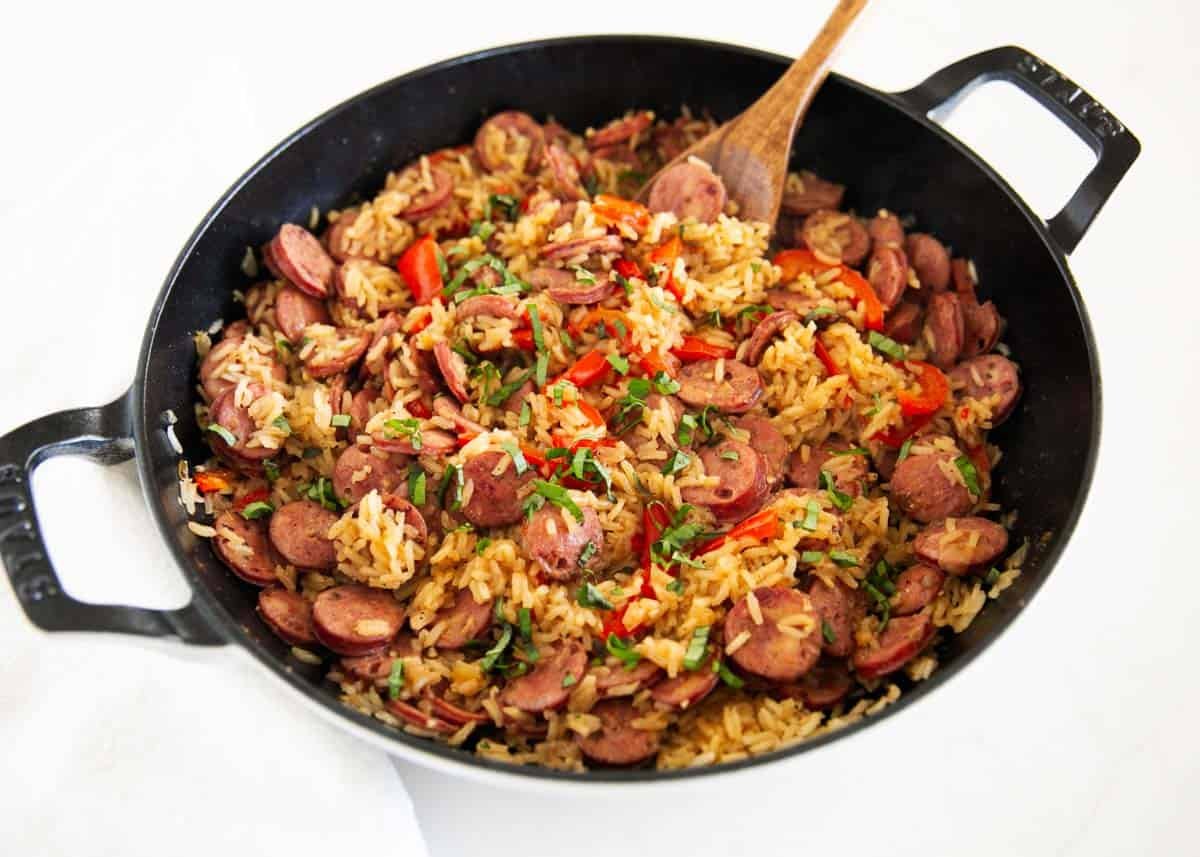 This sausage and rice skillet is the perfect one-pan dinner for busy weeknights packed with savory sausage, rice, and tender veggies! It's a hearty meal the whole family will love. Easy sausage and rice skillet dinner cooked in one pot with smoked sausage, rice, and peppers.