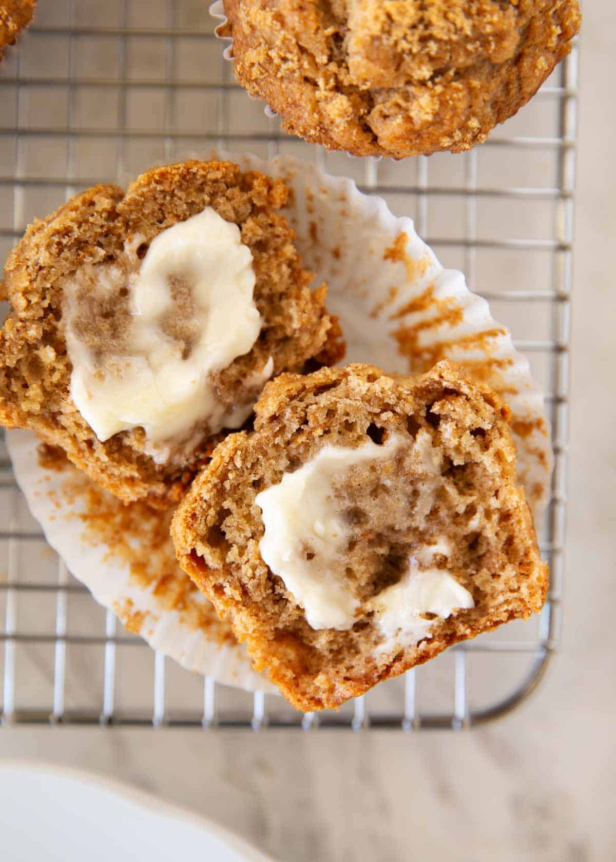 These classic bran muffins bake up soft, hearty, and lightly sweet. They’re a wholesome recipe perfect for a healthy breakfast or snack. Freshly baked bran muffins broken open to show their soft interior cooling on a wire rack.