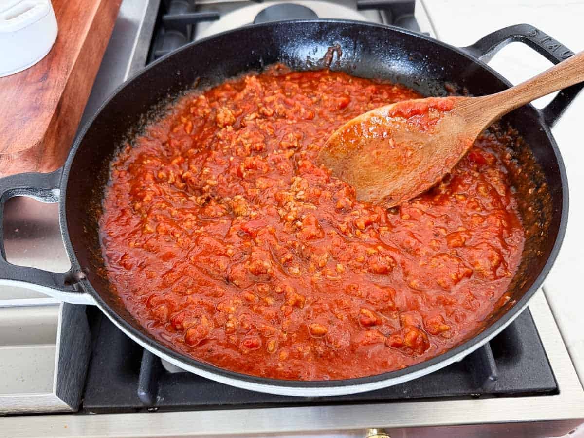 Italian sausage simmering with marinara.