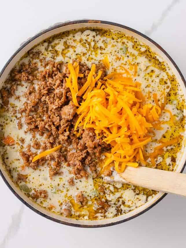 This creamy sausage potato soup is made in one pot with Italian sausage, tender potatoes, and a cheesy broth, it's a cozy way to satisfy the whole family! Add cheese and sausage back into sausage and potato soup.