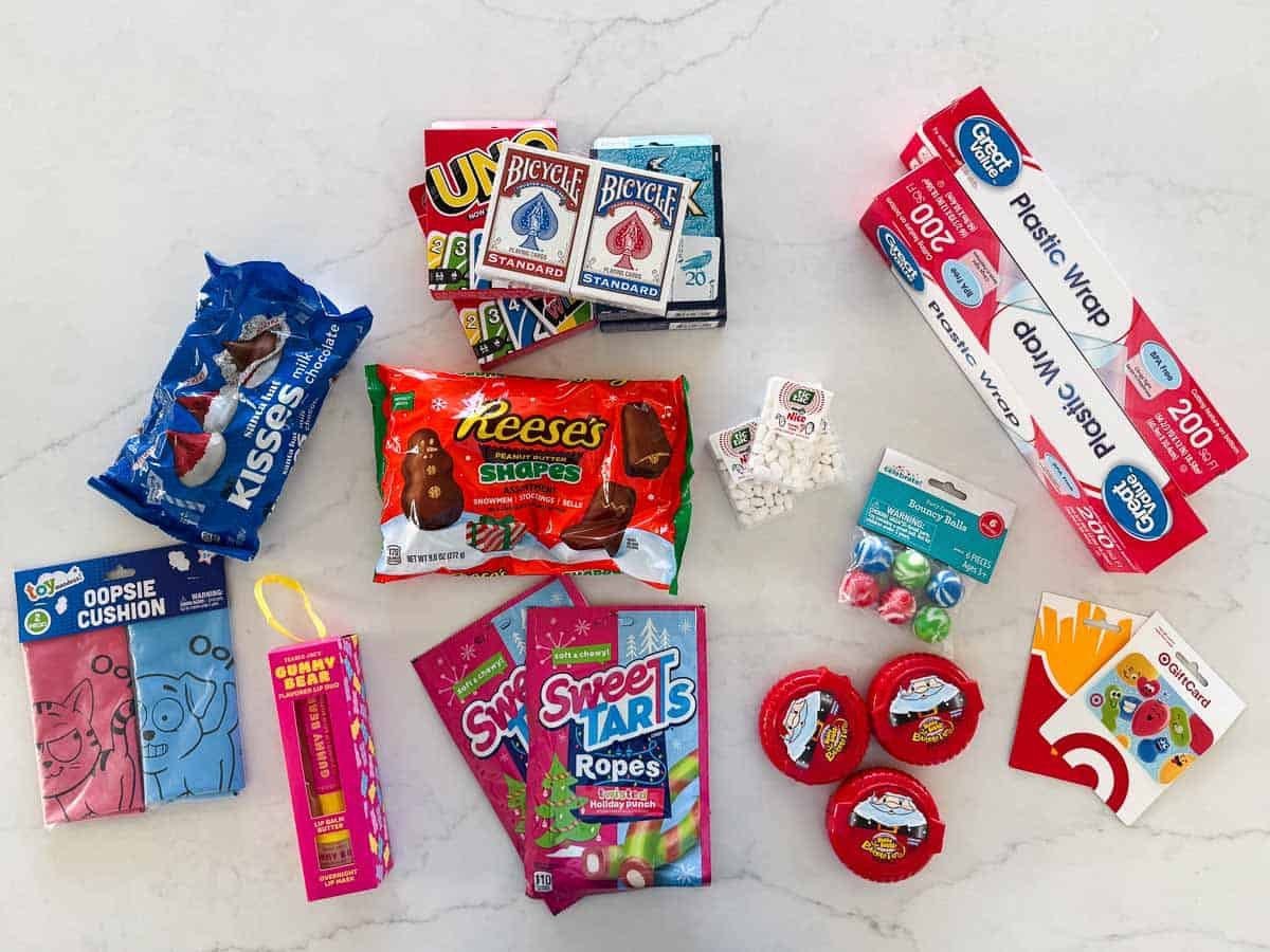 Saran ball game supplies including games, gift cards, candy, gag gifts and saran wrap.